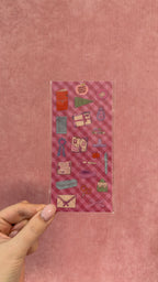 Planche transparente de stickers décoratifs pour journaling et papeterie avec motifs créatifs colorés tenue à la main par Nany Craft Shop